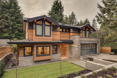 Inspiration for a large transitional mixed siding exterior home remodel in Vancouver