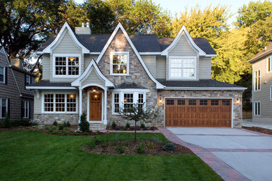 Large elegant beige two-story mixed siding exterior home photo in Minneapolis