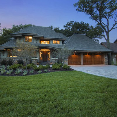 Example of an arts and crafts green exterior home design in Minneapolis