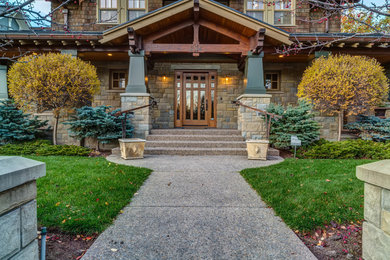 Inspiration for a timeless brown mixed siding exterior home remodel in Calgary