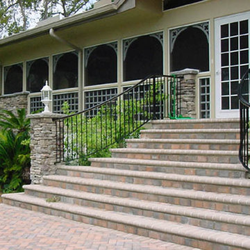 Elegant custom curved exterior stair rail with straight pickets