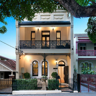 Inspiration for a victorian two-storey beige house exterior in Newcastle - Maitland with a flat roof.