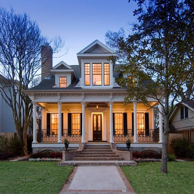Small ornate two-story exterior home photo in Houston