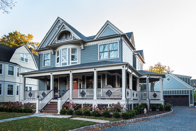 Large victorian green three-story wood gable roof idea in New York
