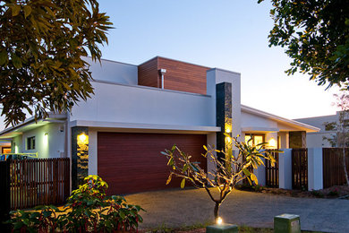 Example of a large minimalist white split-level wood exterior home design in Gold Coast - Tweed
