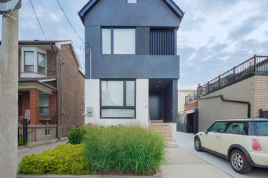 Example of a small trendy three-story exterior home design in Toronto
