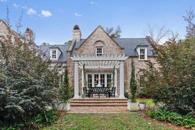 Example of a mid-sized classic two-story brick exterior home design in Atlanta