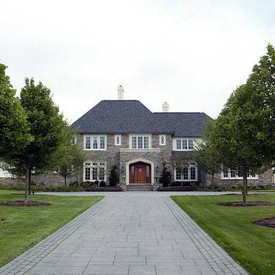 Example of a large classic two-story stone exterior home design in Philadelphia