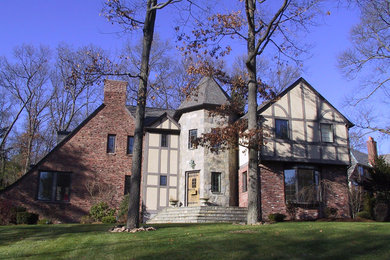Example of a large classic two-story brick exterior home design in Chicago