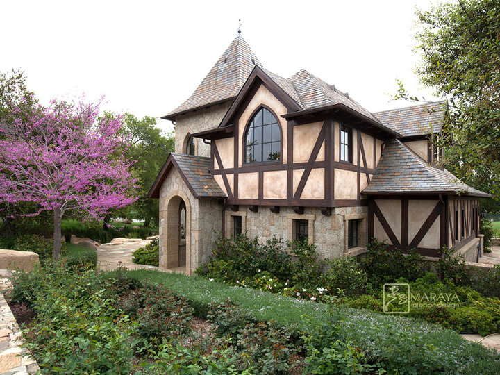 Small cottage beige two-story stone gable roof photo