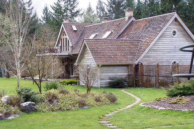 Example of a country exterior home design in Seattle