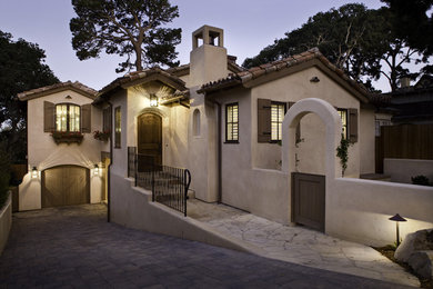 Example of a mid-sized tuscan exterior home design in Other