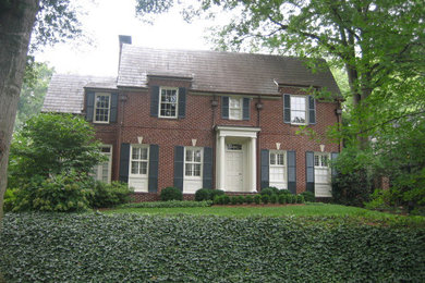 Inspiration for a large timeless red two-story brick exterior home remodel in Atlanta