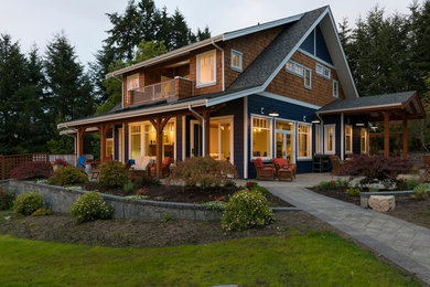 Elegant blue two-story mixed siding gable roof photo in Vancouver