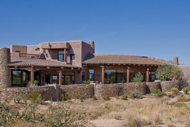 Design ideas for a traditional house exterior in Phoenix.