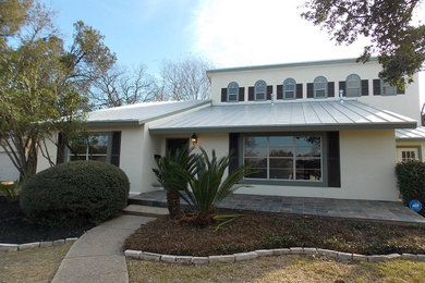 Trendy white two-story concrete exterior home photo in Austin