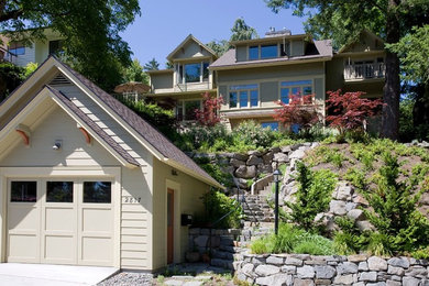 Mid-sized arts and crafts beige three-story wood exterior home photo in Portland with a shingle roof