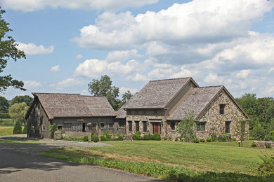 Country two-story stone exterior home photo in New York