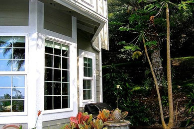 Design ideas for a large and gey two floor house exterior in Hawaii.