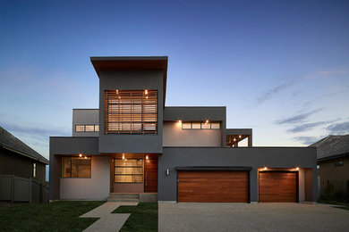 Inspiration for a contemporary gray two-story exterior home remodel in Edmonton