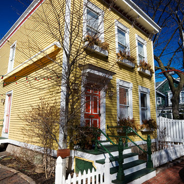 Exterior Home Painting: Yellow Two Story with White Trim