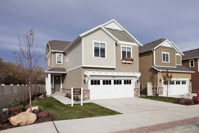 Photo of a medium sized and beige traditional two floor detached house in Salt Lake City with mixed cladding, a pitched roof and a tiled roof.