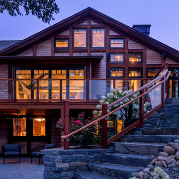 Exterior lake view showcases the naturally preserved cedar siding with sousugiba