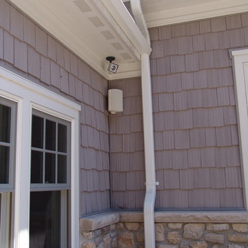 Exterior Mounted Speaker and Surveillance Camera