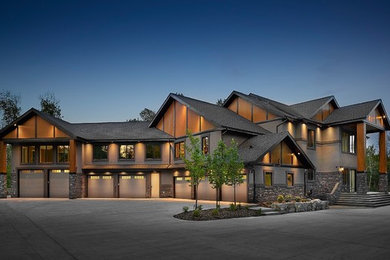 Huge transitional gray two-story stucco exterior home idea in Edmonton