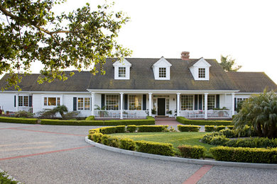 Example of a large classic white one-story wood exterior home design in Santa Barbara