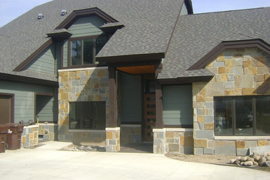 Inspiration for a large timeless blue two-story mixed siding exterior home remodel in Detroit