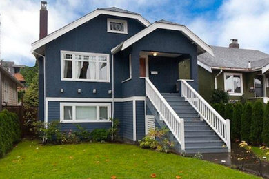 Mid-sized blue three-story wood exterior home photo in Vancouver
