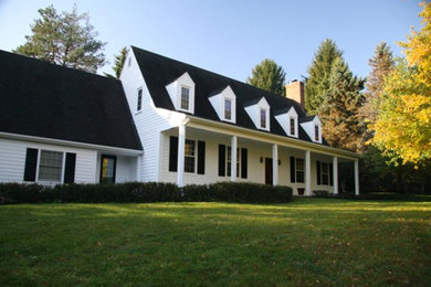 Example of a large classic white two-story wood house exterior design in Detroit