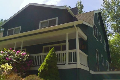 Example of a country exterior home design in Seattle