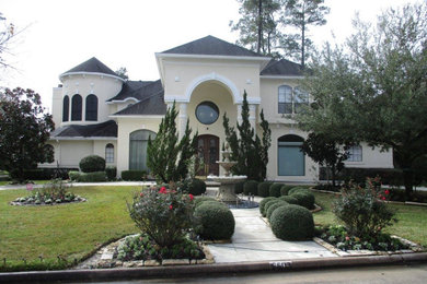 Inspiration for a large modern beige two-story house exterior remodel in Houston