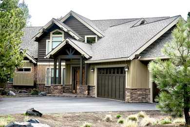 Large craftsman beige two-story wood exterior home idea in Other with a shingle roof