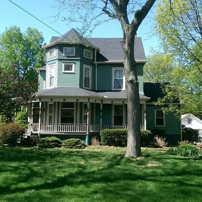 Ornate green exterior home photo in Chicago