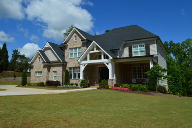 Large craftsman beige two-story concrete fiberboard exterior home idea in Atlanta with a shingle roof