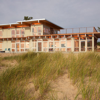 Inspiration for a large contemporary brown two-story wood flat roof remodel in Grand Rapids