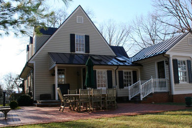 Example of a farmhouse exterior home design in Richmond