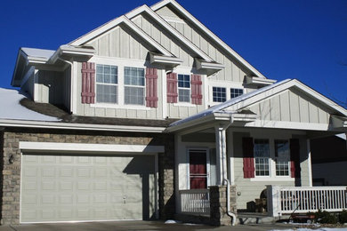 Example of a large classic gray two-story mixed siding exterior home design in Denver with a shingle roof