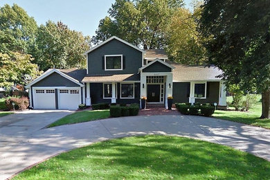 Inspiration for a mid-sized timeless gray two-story wood exterior home remodel in Kansas City with a shingle roof