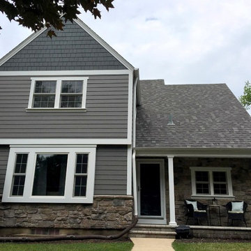Exterior renovation in Aurora IL with new siding, windows, and stone.