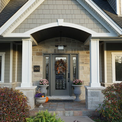 Large traditional gray two-story mixed siding gable roof idea in Chicago