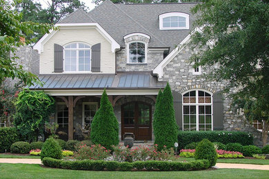 Large elegant beige two-story mixed siding exterior home photo in Raleigh