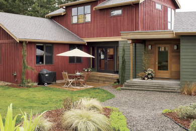 Example of a cottage two-story wood exterior home design in Seattle