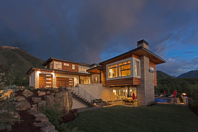 Inspiration for a large contemporary three-story wood flat roof remodel in Salt Lake City