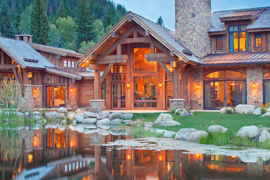 Inspiration for a rustic two-story exterior home remodel in Denver