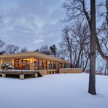 exterior view from south shows garage addition and deck