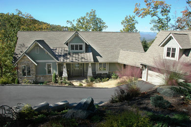 This is an example of a medium sized and gey classic two floor detached house in Other with a pitched roof, a mixed material roof and concrete fibreboard cladding.